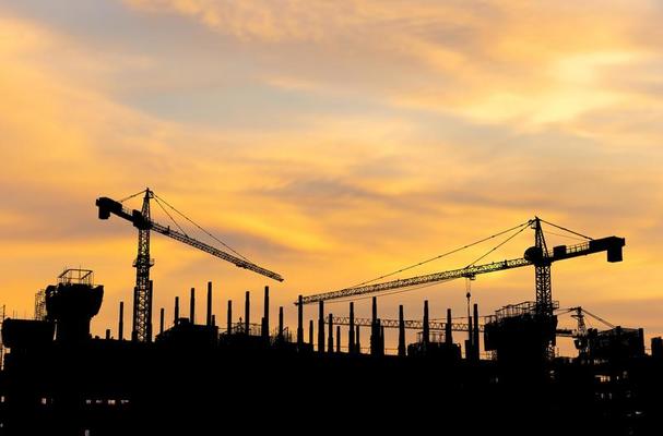 Contractors on site with safety gear and insured operations